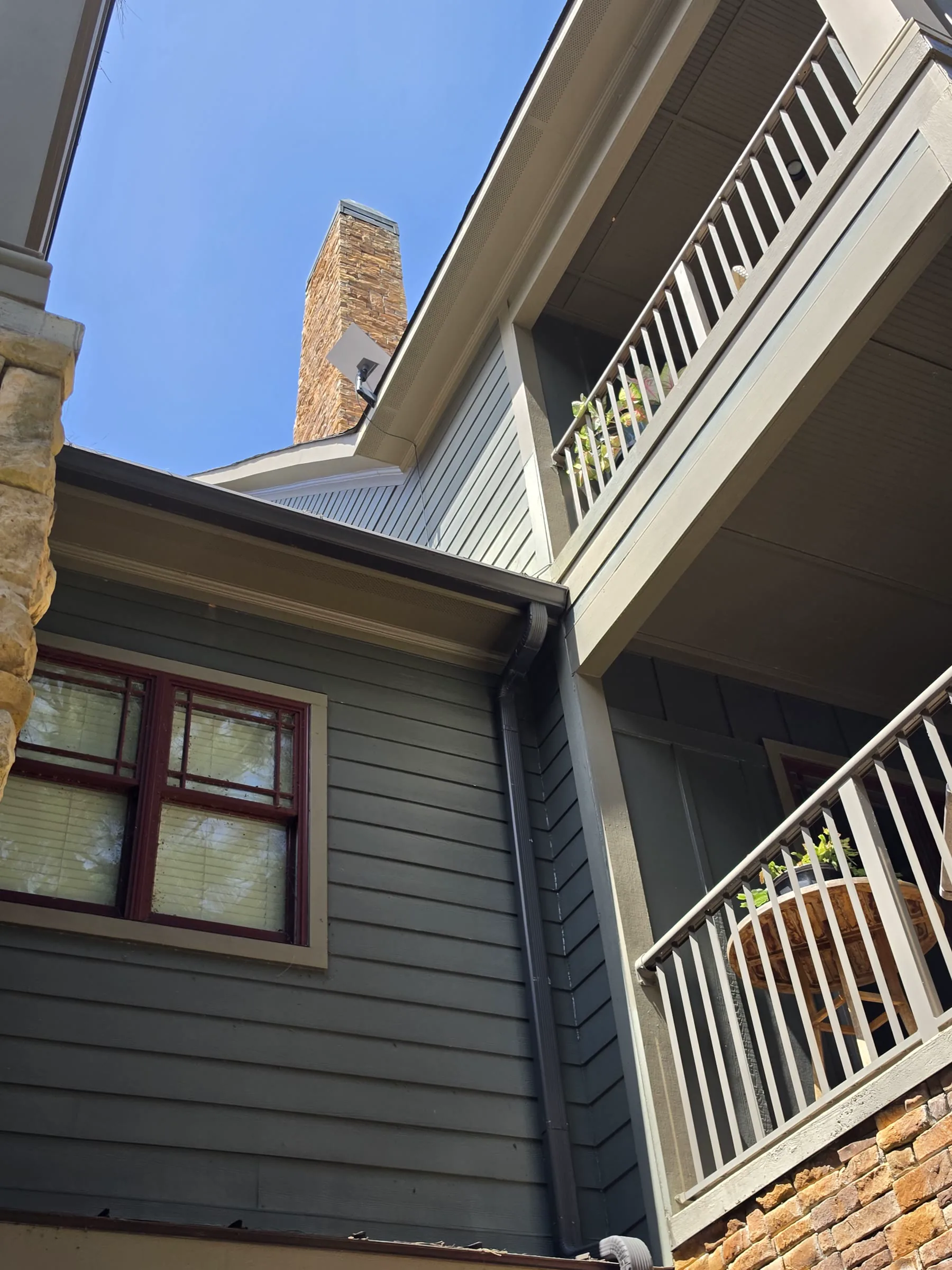 Starlink antenna mounted high on a three-story Lake Martin home near Alexander City, Alabama