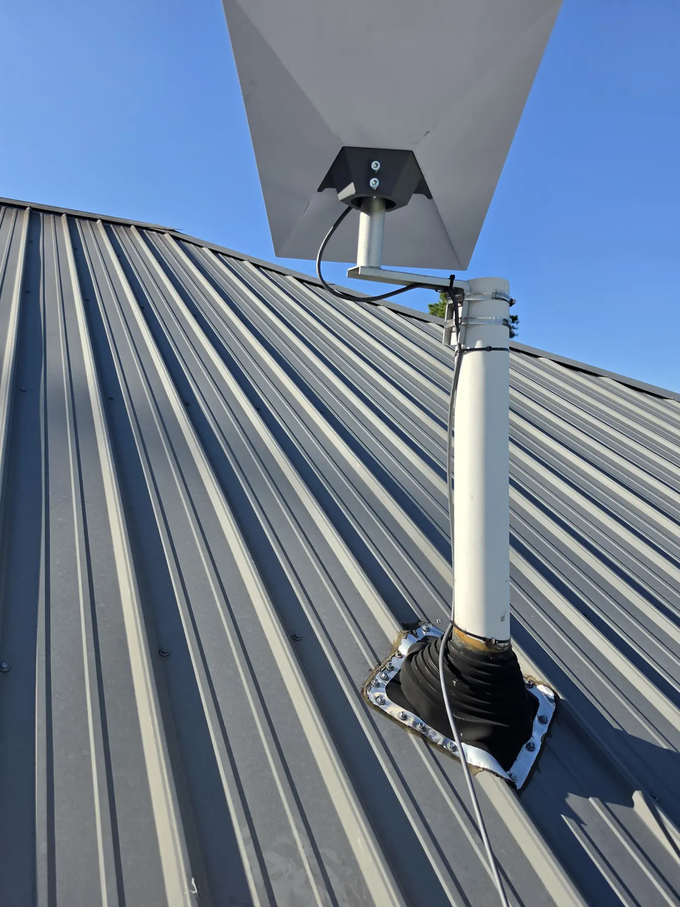 Starlink dish attached to an existing roof-mounted support in Warrior Alabama